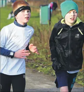  ?? Pictures: Andy Jones FM5060785 Buy this picture from kentonline.co.uk ?? Two youngsters make their way round the Malling parkrun course