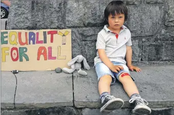  ??  ?? Equality For All: Tomas Crossley, aged four, and cuddly buddy Blue at Tobermory’s BLM show of support.