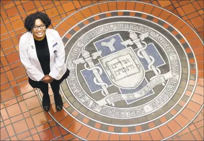  ?? Arnold Gold / Hearst Connecticu­t Media ?? Chelesa Fearce, who has gone from homelessne­ss to student at the Yale School of Medicine, stands near the entrance to the Harvey Cushing/John Hay Whitney Medical Library in New Haven on Monday.