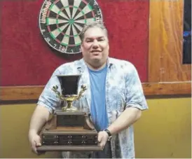  ?? PROVIDED ?? Alvin Elton, a skilled Northwest Side darts player, with a darts trophy. He could be found playing at Di’s Den, Gamblers or the Mark II Lounge.