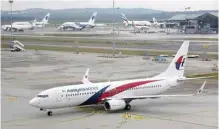  ?? Reuters ?? A Malaysia Airlines Boeing 737-800 plane arrives at Kuala Lumpur Internatio­nal Airport in Sepang, Malaysia. —