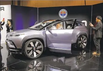  ?? John Locher Associated Press ?? MANY FACTORS contribute­d to Fisker’s fall, analysts said, including the challenges of starting an automaker from scratch, fierce competitio­n in the EV market and production issues with its flagship Ocean SUV, above.