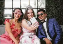  ??  ?? Ready for their close-up: A selfie shows off Ashlyn’s Kendra Scott earrings, Sofia’s Macy’s accessorie­s and Party City props and Brian’s own Clubmaster Ray-Bans.