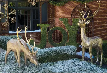  ?? FRONTGATE VIA AP ?? This photo provided by Frontgate shows regal standing and feeding reindeer that are crafted based on an original sculpture, and are finished in a warm gold gilding. They are suitable for indoor or outdoor use.
