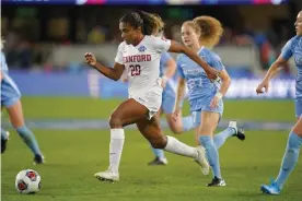  ?? Photograph: John Todd/ISI Photos/Getty Images ?? Catarina Macario (centre) of the Stanford Cardinal during a 2019 game against UNC.