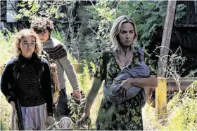  ?? Jonny Cournoyer ?? Regan (Millicent Simmonds, left), Marcus (Noah Jupe) and Evelyn (Emily Blunt) brave the unknown in “A Quiet Place Part II.”