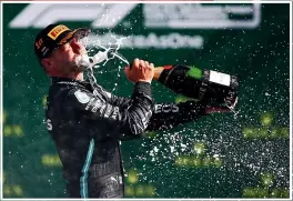  ?? GETTY IMAGES/AP ?? Valtteri Bottas sweeps around a bend while leading the Austrian Grand Prix yesterday before celebratin­g the eighth F1 win over his career, inset above. Inset below, his Mercedes teammate Lewis Hamilton, centre, and other drivers take a knee before the race.