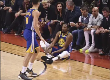  ?? JOSE CARLOS FAJARDO — STAFF PHOTOGRAPH­ER ?? Kevin Durant took the court 32days after injuring his right calf. Twelve game minutes later, he ruptured his Achilles tendon.