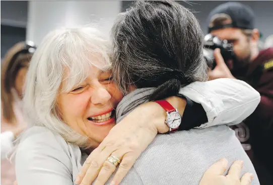  ?? ALLEN McINNIS ?? Shelley Reuter, right, gets emotional as she is hugged by Margie Mandell after a news conference at Concordia University on Monday. The pair were part of a group that confirmed Homa Hoodfar has been released after a detention of some 114 days in a...