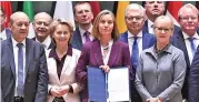  ?? (AFP) ?? EU Foreign Policy chief Federica Mogherini (centre) poses with foreign and defence ministers from EU states in Brussels on Monday