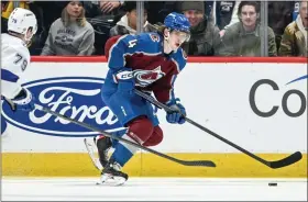  ?? AARON ONTIVEROZ — THE DENVER POST ?? Bowen Byram (4) of the Colorado Avalanche handles against the Tampa Bay Lightning during the first period at Ball Arena in Denver on Tuesday, February 14, 2023.