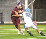  ?? PAUL W. GILLESPIE/CAPITAL GAZETTE ?? Broadneck junior quarterbac­k Josh Ehrlich, shown being tackled by South River’s Lonnell Owens-Pabon during a game last week, rallied the Bruins past Old Mill by throwing a late touchdown to Eli Harris on Thursday.