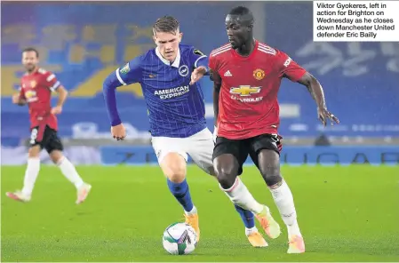  ??  ?? Viktor Gyokeres, left in action for Brighton on Wednesday as he closes down Manchester United defender Eric Bailly