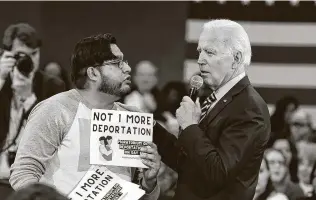  ?? Meg Kinnard / Associated Press file photo ?? Then-Democratic presidenti­al hopeful Joe Biden talks with a protester objecting to deportatio­ns during a town hall at Lander University in Greenwood, S.C., on Nov. 21, 2019.