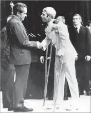  ?? Associated Press ?? JOHN McCAIN greets President Nixon in 1973 upon returning after 5 1⁄2 years as a prisoner of war in Vietnam, marked by torture and solitary confinemen­t.