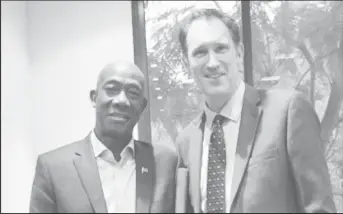  ??  ?? Prime Minister Keith Rowley (left) with CEO of Cricket Australia, James Sutherland, during their meeting.