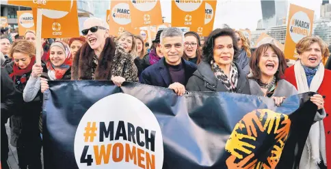  ??  ?? London’s Mayor Sadiq Khan joins women including Annie Lennox, Bianca Jagger and refugees for the ‘March4Wome­n’, in London, Britain. — Reuters phto