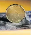  ?? BERG BLOOM- ?? The value of the loonie is no longer as tied in to Canadian oil prices as it once was, analysts say.