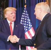  ?? ALEX BRANDON/AP ?? Former President Donald Trump shakes hands with GOP Sen. Lindsey Graham on Saturday in Columbia, S.C., after an earlier campaign stop in New Hampshire.