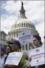  ?? THE ASSOCIATED PRESS ?? Steven McCarty, right, and others, attends an event in support of transgende­r members of the military, Wednesday, on Capitol Hill in Washington, after President Donald Trump said he wants transgende­r people barred from serving in the U.S. military “in...