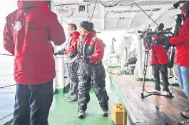  ?? ?? Colombian researcher Andrea Bonilla Garzon (centre) recover a hydrophone with members of the Colombian research vessel ‘ARC Simon Bolivar’ ship in the Barnart Pt in the south coast of Livingston Island, in the South Shetland Islands archipelag­o.