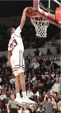  ?? (Photo by Jason Cleveland, SDN) ?? Mississipp­i State guard and former Starkville High School player Tyson Carter dunks the basketball in the second half against the Kentucky Wildcats Saturday.