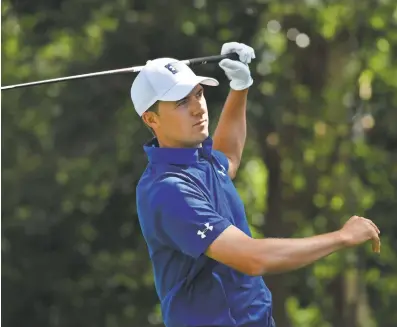  ?? MICHAEL MADRID/USA TODAY SPORTS ?? Jordan Spieth reacts after hitting his tee shot on the second hole during the second round of the Masters golf tournament at Augusta National Golf Club.