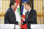  ?? LUDOVIC MARIN / POOL / AP ?? Lebanese Prime Minister Saad Hariri (left) shakes hands in Septemberw­ith French President EmmanuelMa­cron at the Élysée Palace in Paris. Hariri will visit France again Saturday, Macron’s office said.