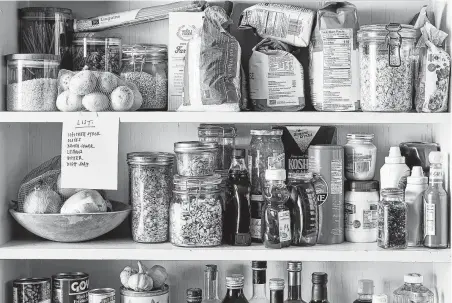  ?? Julia Gartland / New York Times ?? With everyone being urged to hunker down to limit exposure to the coronaviru­s, you’ll need to stock up on at least 14 days of supplies. That means wisely stocking your pantry and refrigerat­or.