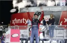  ?? TERRY RENNA — THE ASSOCIATED PRESS ?? William Byron, who finished third in Saturday’s race, celebrates in Victory Lane after winning the Xfinity Series championsh­ip Saturday at Homestead-Miami Speedway in Homestead, Fla. Cole Custer won the race.