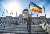  ?? THOM BRIDGE AP FILE ?? Demonstrat­ors gather at the Montana Capitol protesting anti-LGBTQ legislatio­n last year.