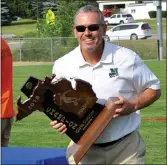  ?? MEDIANEWS GROUP FILE PHOTO ?? Novi athletic director Brian Gordon gets set to present the Wildcat girls soccer team with the 2018 Division 1 state championsh­ip. Gordon is retiring from his position at the end of the school year.