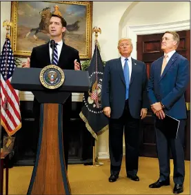  ?? AP/EVAN VUCCI ?? U.S. Sen. Tom Cotton (left), speaking Wednesday at the White House alongside President Donald Trump and Sen. David Perdue, called the current legal immigratio­n system “an obsolete disaster.”