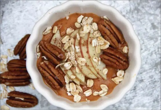  ?? MELISSA D’ARABIAN VIA AP ?? Loading up the freezer with these pumpkin and spice breakfast bowls is an excellent plan-ahead strategy, whether you’re a mom of four, or you just want to streamline your mornings.