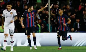  ?? Photograph: Albert Gea/Reuters ?? Raphinha (right) is congratula­ted on his equaliser by Robert Lewandowsk­i, who made no contact with the ball, wrong-footing David de Gea.