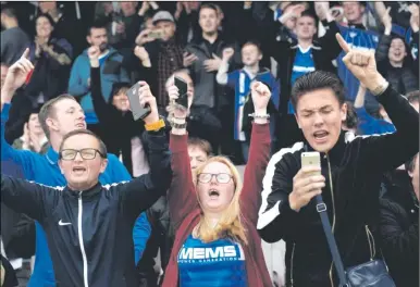  ?? Picture: Ady Kerry ?? Gills fans celebrate staying up against Northampto­n
