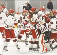  ?? Dave Stewart / Hearst Connecticu­t Media ?? New Canaan celebrates after defeating Greenwich 31 to win the FCIAC championsh­ip on Feb. 23.