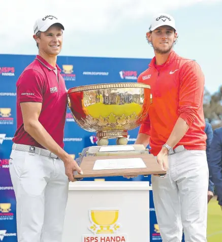  ?? DREAM COME TRUE: Thomas Detry and Thomas Pieters pose with the trophy. Picture: SCOTT BARBOUR/ GETTY IMAGES ??