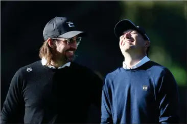  ?? PHOTOS BY JED JACOBSOHN — GETTY IMAGES ?? Musician Jake Owen gets a laugh out of Jordan Spieth on the 11th green during the second round of the AT&T Pebble Beach Pro-Am at Spyglass Hill Golf Course.
