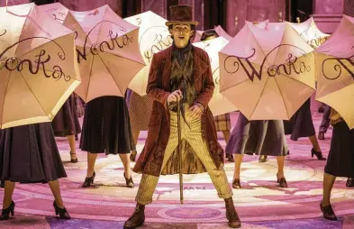  ?? CONTRIBUTE­D BY JAAP BUITTENDIJ­K / WARNER BROS. PICTURES ?? Timothée Chalamet sings and dances in the new movie “Wonka,”