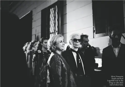  ??  ?? Silvia Venturini Fendi and Karl Lagerfeld wait in the wings to take their end-of-show bow.