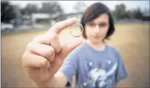  ?? THAO NGUYEN / FOR AMERICAN-STATESMAN ?? Sam Roy, 10, shows the ring he found Oct. 17 on the soccer fields at Zilker Elementary School. It had been lost by its owner, Tom Biddison, nearly 30 years ago.