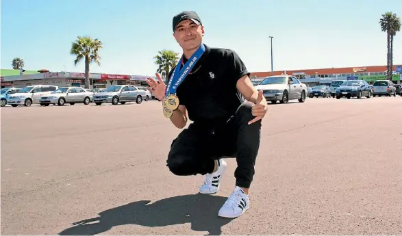  ?? KYMBERLEE FERNANDES/FAIRFAX NZ ?? Carlos Skipper with his medals from several internatio­nal dance competitio­ns.