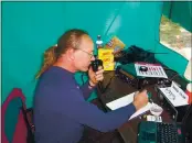  ?? PHOTOS CONTRIBUTE­D ?? Jaye Inabnit operates in a tent above Horse Mountain during a ham radio contest.