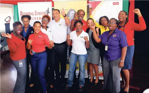  ?? CONTRIBUTE­D ?? Dr Christophe­r Tufton, minister of health, gives a thumbs-up while sharing a moment with the team captains from the corporate companies in this year’s Jamaica Moves Corporate Challenge.