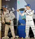  ??  ?? Kiwi driver Brendon Hartley, right, celebrates with Porsche team-mate Mark Webber.