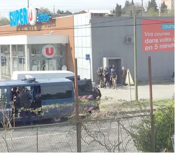  ??  ?? Police are seen at the scene of a hostage situation in a supermarke­t in Trebes, Aude. — Reuters photo