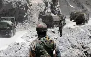  ?? (ANI) ?? An Army convoy moves towards the Zojilla pass, in Drass on 28 May.