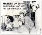  ??  ?? MASKED UP Shirley and medical staff with her son in hospital