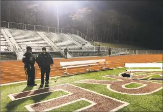  ?? Ahmad Austin / Associated Press ?? Police investigat­e the scene after a gunman shot into a crowd of people during a football game at Pleasantvi­lle High School in Pleasantvi­lle, N.J., Friday Players and spectators ran for cover Friday night when a gunman opened fire at the New Jersey high school football game.